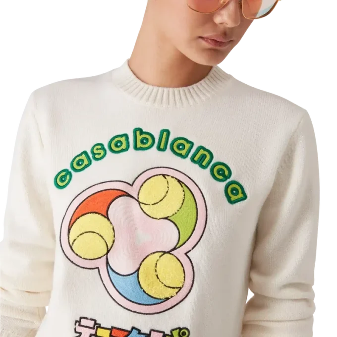 Tennisball-Merino-Strickpullover mit Rundhalsausschnitt Tennisball-Merino-Strickpullover mit Rundhalsausschnitt